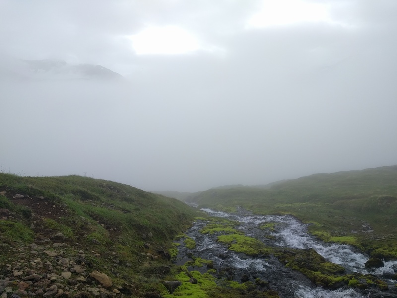 looking back down through
the clouds, the opposite peaks are exposed