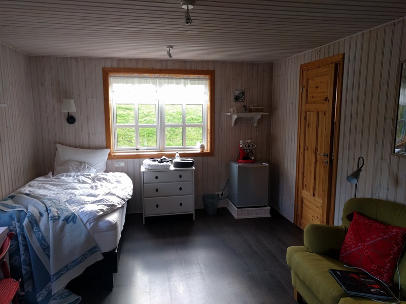 lower floor of cabin,
containing bed, desk, couch, miscellany