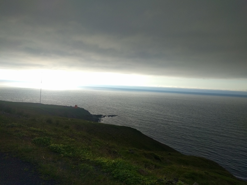 an orange lighthouse in the
distance
