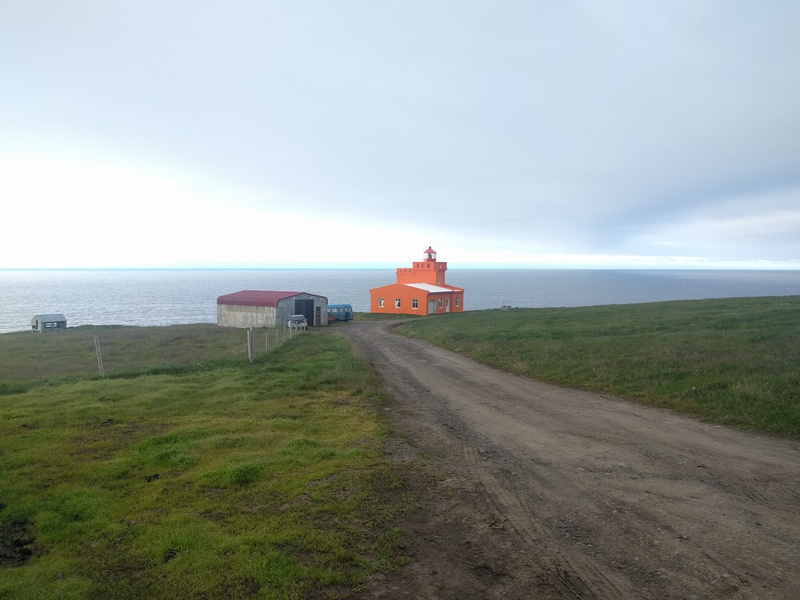 an orange lighthouse from
nearby